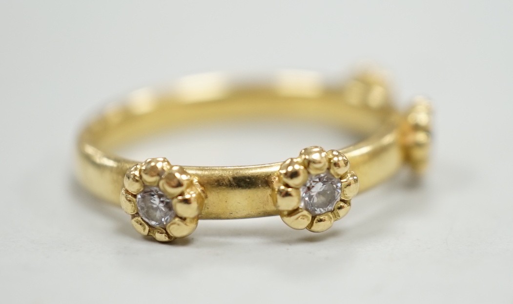 A modern 18ct gold and four stone diamond set ring, size K, gross weight 4 grams.